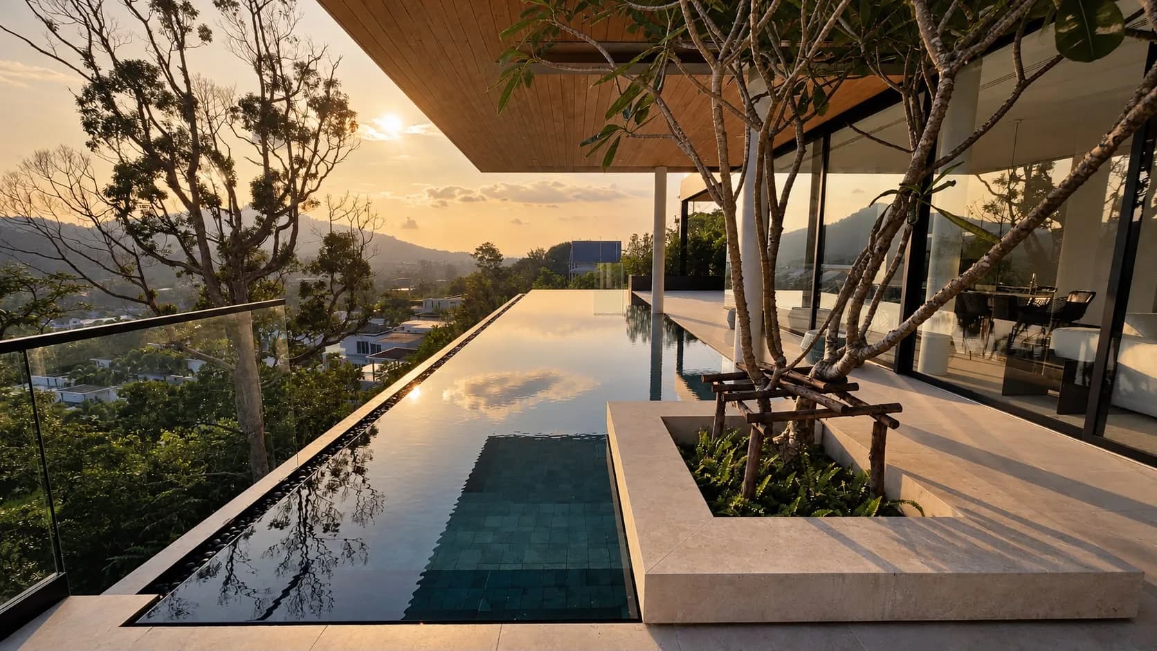 Perch House, infinity pool at sunset under the timber soffit, looking out over the Kamala valley